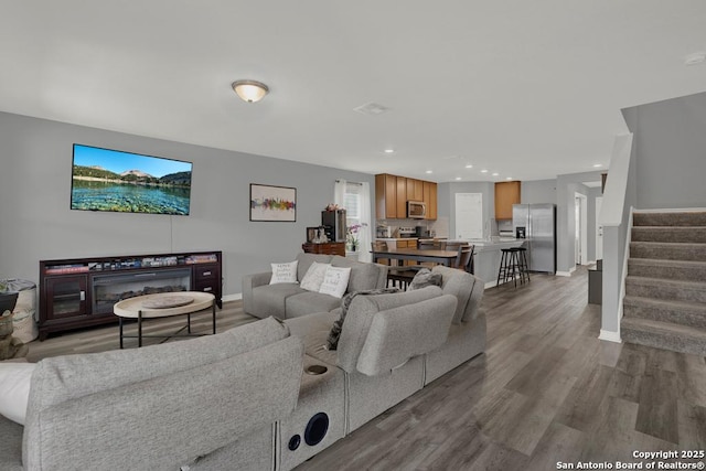 417 Briarfield, Seguin, TX 78155 - living area featuring stairway, recessed lighting, baseboards, and wood finished floors