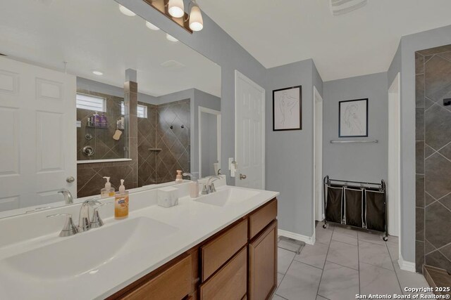 417 Briarfield, Seguin, TX 78155 - full bath featuring double vanity, visible vents, a walk in shower, and a sink