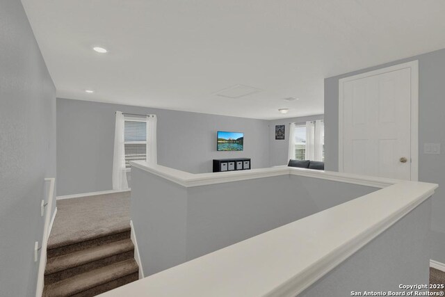 417 Briarfield, Seguin, TX 78155 - hall featuring recessed lighting, carpet flooring, an upstairs landing, and baseboards