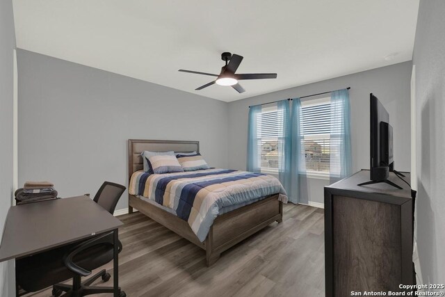 417 Briarfield, Seguin, TX 78155 - bedroom with light wood finished floors, ceiling fan, and baseboards