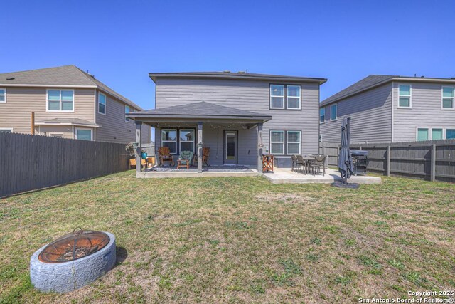 417 Briarfield, Seguin, TX 78155 - back of house with a patio area, a lawn, an outdoor fire pit, and a fenced backyard