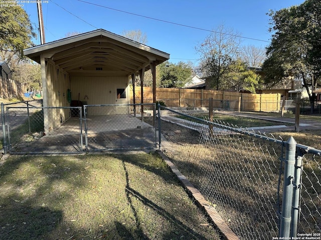 exterior space featuring a gate and fence