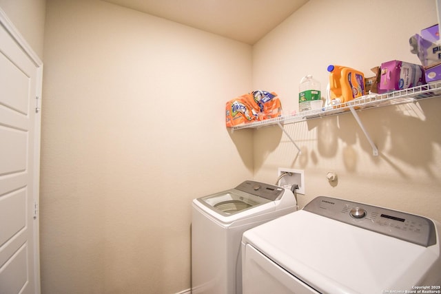 laundry room featuring laundry area and separate washer and dryer