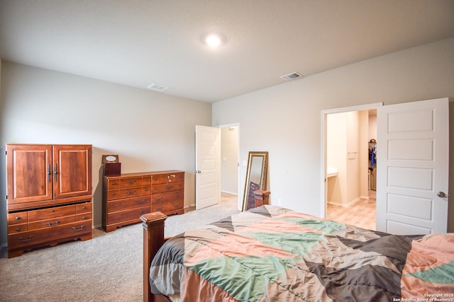 bedroom with light carpet and visible vents