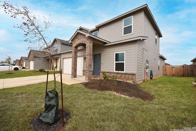 view of front of house with a front yard, fence, concrete driveway, and brick siding