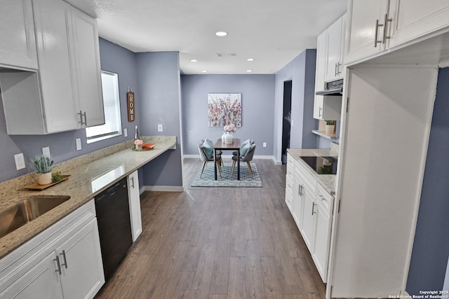 kitchen featuring dark wood-style floors, light stone counters, black appliances, white cabinetry, and recessed lighting