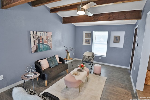 living room with a ceiling fan, wood finished floors, beam ceiling, and baseboards