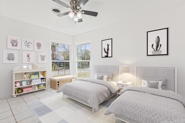 tiled bedroom with visible vents and a ceiling fan