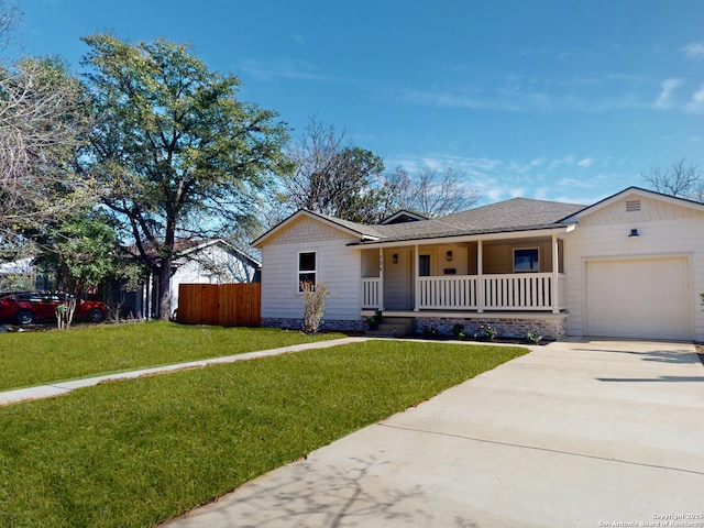 ranch-style house featuring a garage, a porch, a front yard, and fence