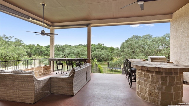 view of patio / terrace with ceiling fan, an outdoor hangout area, area for grilling, and outdoor wet bar