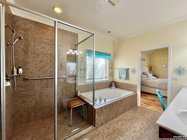 ensuite bathroom featuring a garden tub, vanity, a stall shower, ensuite bath, and crown molding