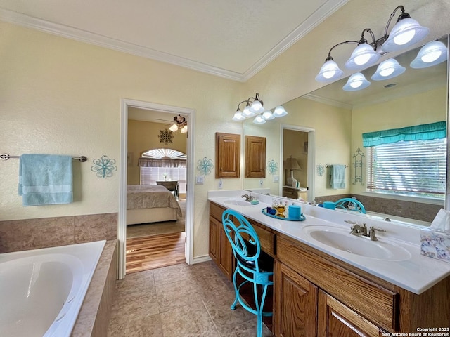 full bathroom featuring connected bathroom, double vanity, a sink, and ornamental molding