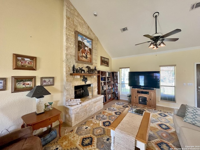 living room with crown molding, visible vents, a fireplace, and high vaulted ceiling