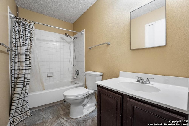 full bathroom featuring a textured wall, toilet, shower / bath combo with shower curtain, a textured ceiling, and vanity