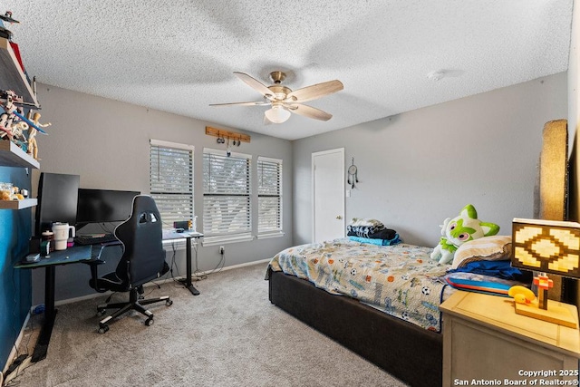 bedroom with carpet floors, ceiling fan, baseboards, and a textured ceiling