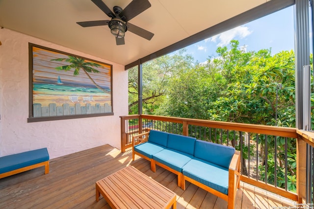 wooden terrace featuring a ceiling fan and an outdoor hangout area