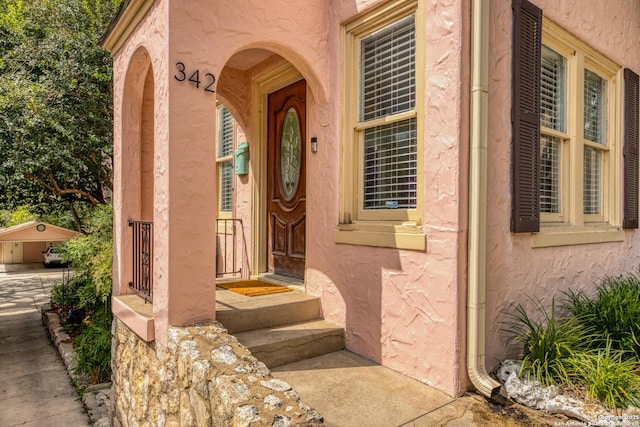 doorway to property with stucco siding