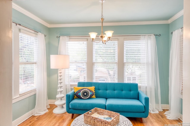 living area featuring crown molding, a wealth of natural light, and wood finished floors