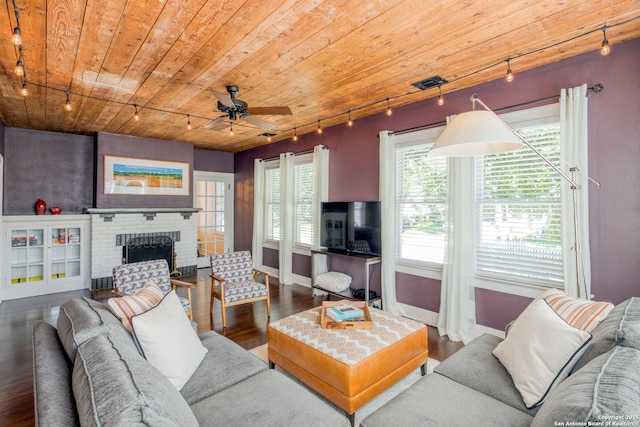 living area with wooden ceiling, a fireplace, track lighting, and wood finished floors