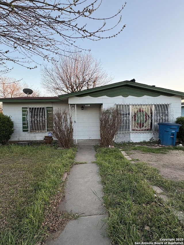 view of front of home with concrete block siding