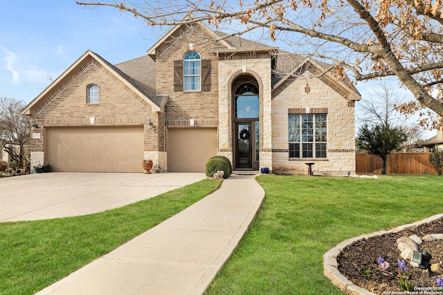 view of front facade with concrete driveway, brick siding, and fence