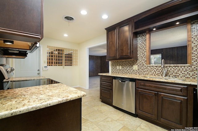 kitchen featuring decorative backsplash, visible vents, a sink, and stainless steel dishwasher