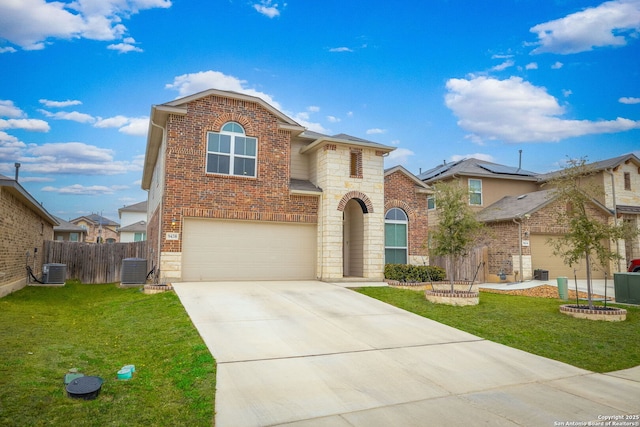 traditional-style home featuring stone siding, brick siding, a front lawn, and driveway