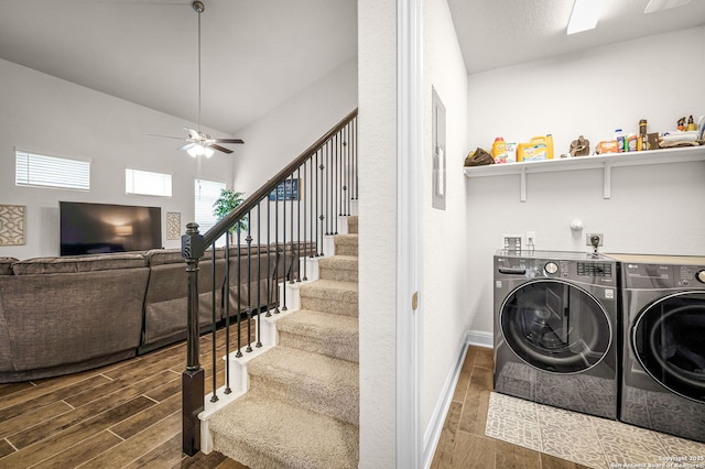 laundry room featuring washer and clothes dryer, a ceiling fan, wood tiled floor, laundry area, and baseboards