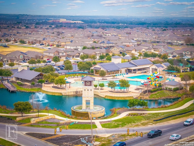 bird's eye view with a residential view and a water view