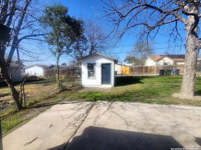 view of shed featuring fence