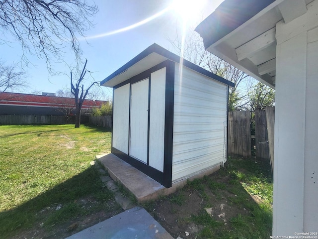 view of shed featuring a fenced backyard