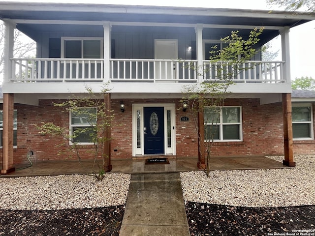 view of front of home featuring brick siding