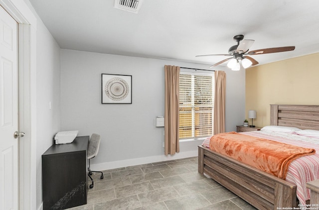 bedroom featuring baseboards, visible vents, and a ceiling fan