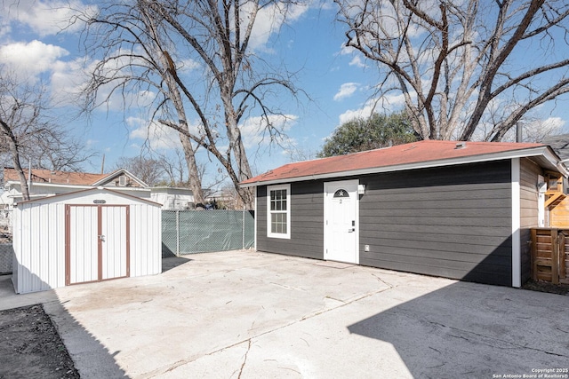 view of shed with fence