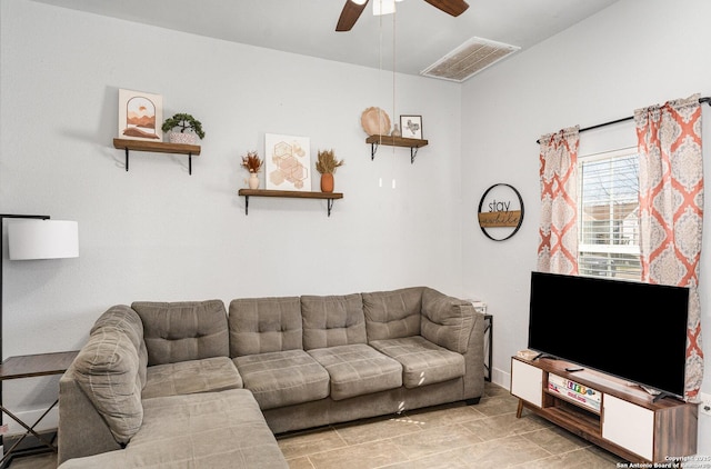 living area featuring visible vents and a ceiling fan