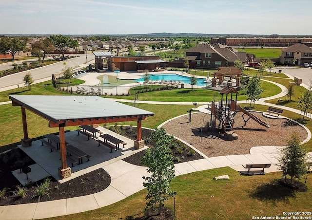 view of property's community with a pool, a patio area, playground community, and a hot tub