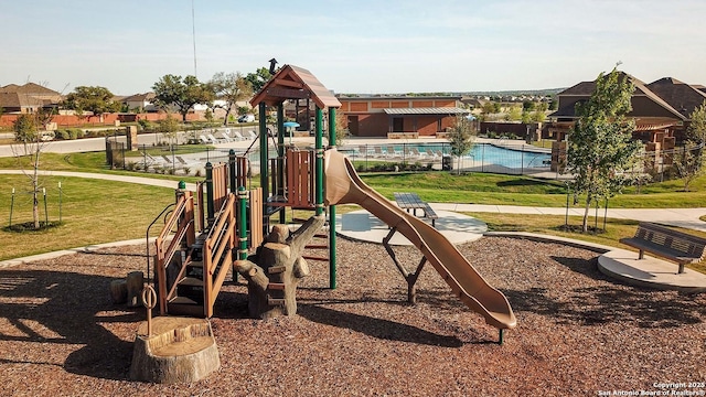 communal playground with a lawn