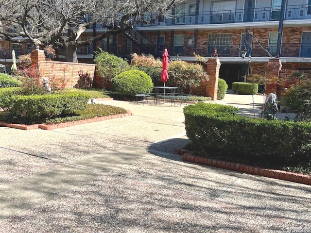 view of home's community featuring a patio area