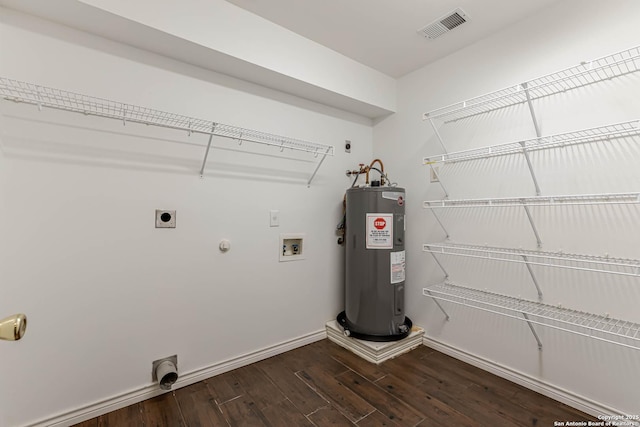 clothes washing area featuring washer hookup, visible vents, electric water heater, electric dryer hookup, and laundry area