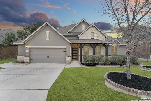 view of front of house with roof with shingles, an attached garage, a front yard, stone siding, and driveway