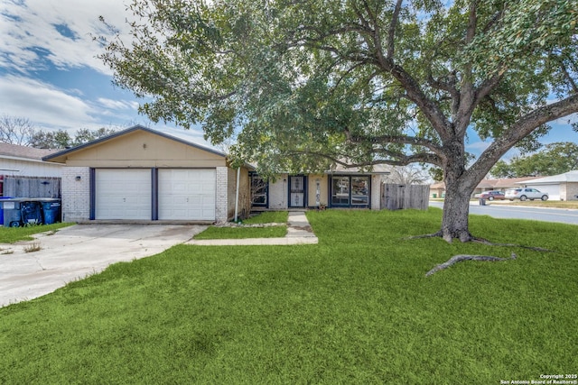 single story home with an attached garage, driveway, a front lawn, and brick siding