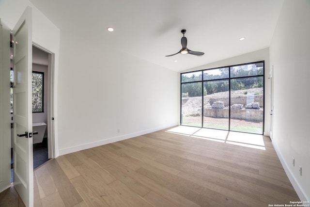 empty room featuring light wood-style floors, recessed lighting, a healthy amount of sunlight, and a ceiling fan