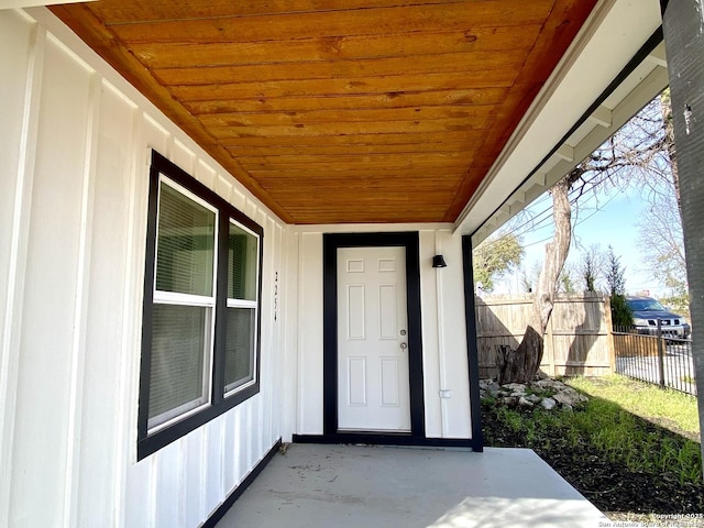 doorway to property with fence