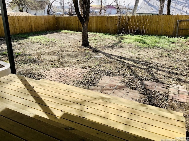 view of yard with fence and a patio