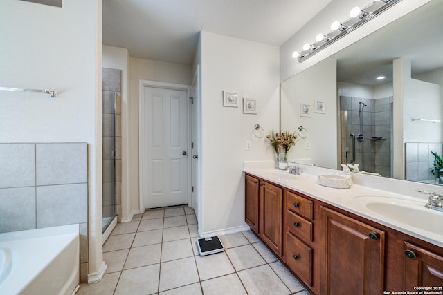 full bathroom with tile patterned flooring, a shower stall, and a sink