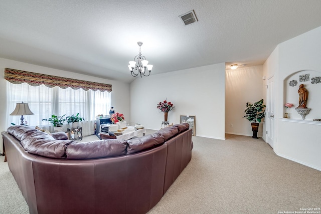 living room with visible vents, an inviting chandelier, light carpet, a textured ceiling, and baseboards