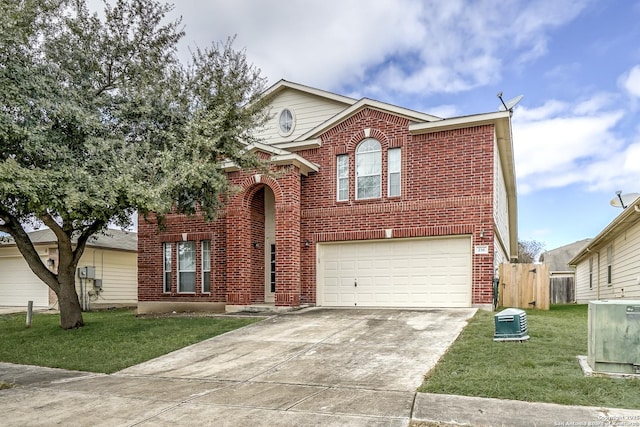 traditional-style home with brick siding, concrete driveway, a front yard, fence, and a garage