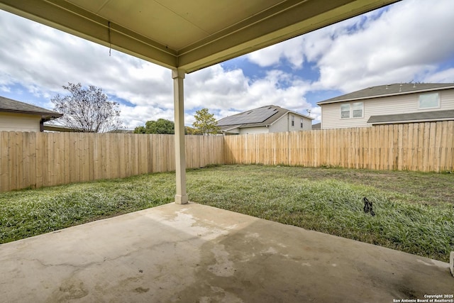 view of yard with a patio and a fenced backyard