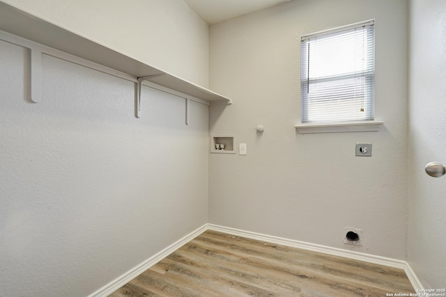 laundry area with hookup for a washing machine, hookup for a gas dryer, laundry area, light wood-style floors, and electric dryer hookup