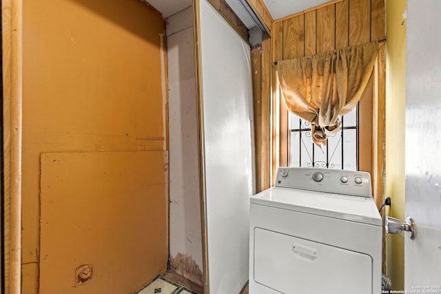 clothes washing area featuring washer / dryer and laundry area